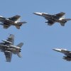 NAS Lemoore Hornets make a pass over the base's flight line.